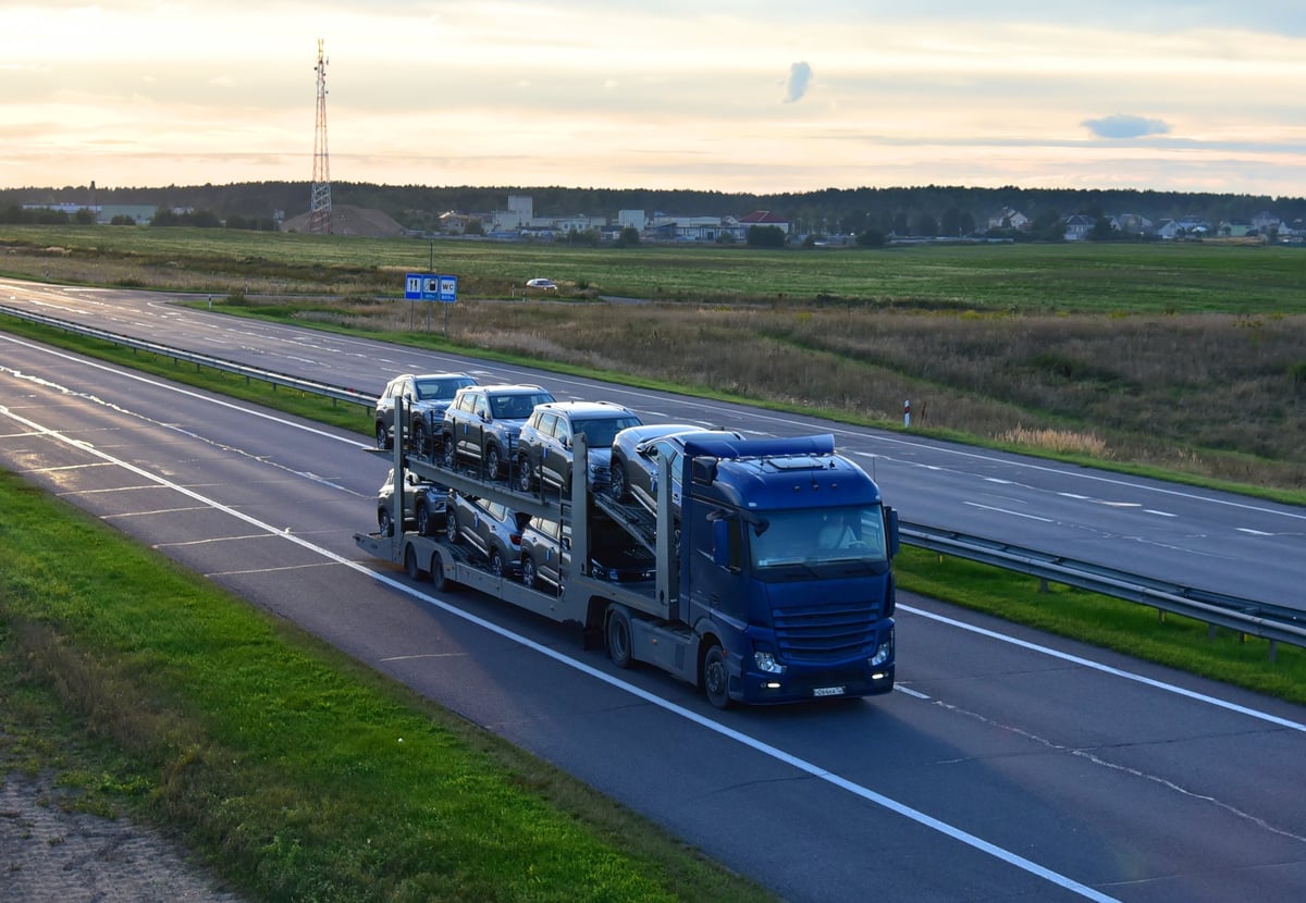 Car transporter hauling vehicles on a highway